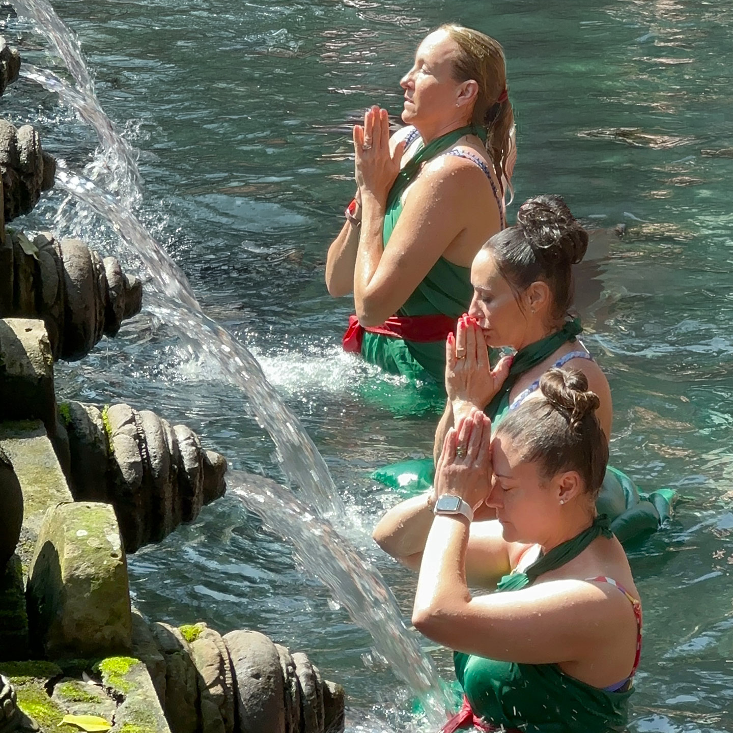 Sacred Tirta Empul water temple in Bali — softly lit pool used for ritual blessing